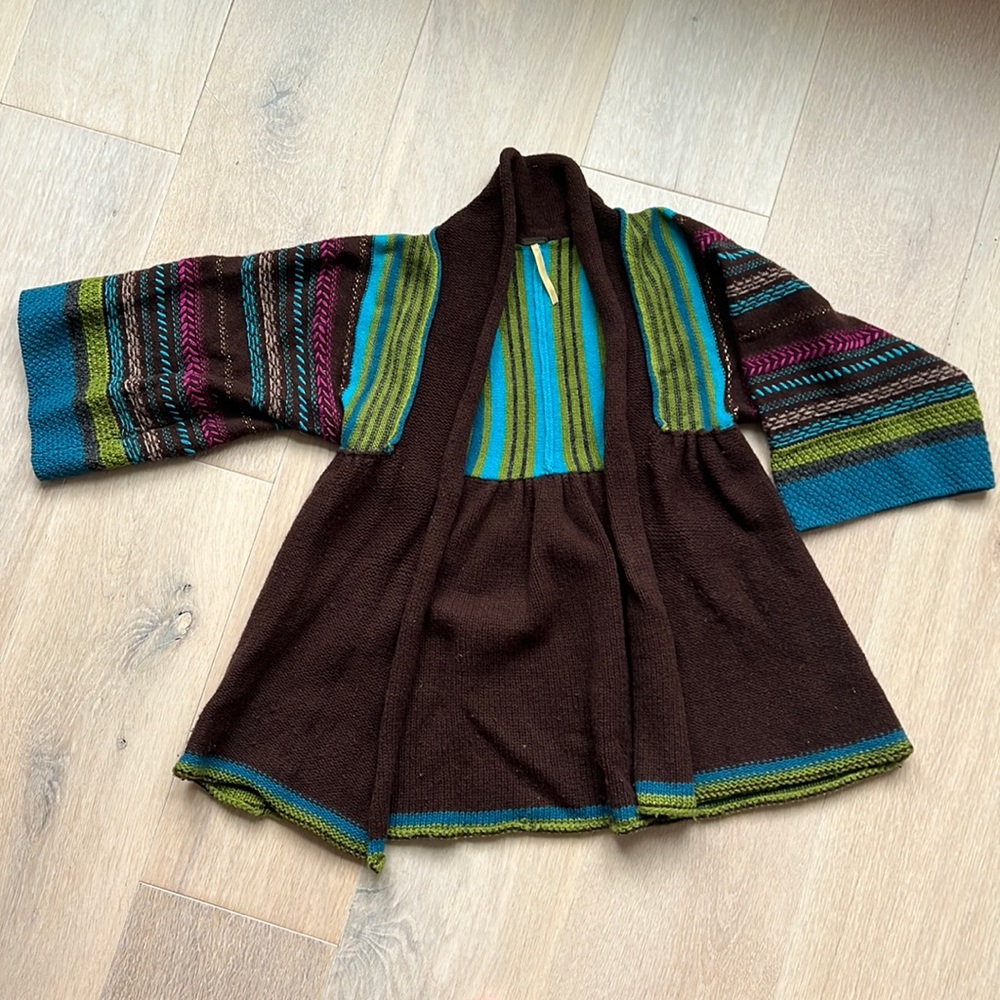 Free People sweater with multi color accents on sleeves
